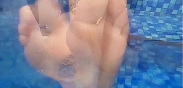  Foot fetish in pool. Mature plays with her legs in the water and teases you with wet feet.